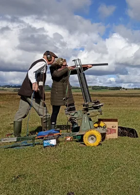 Person receiving a shooting lesson